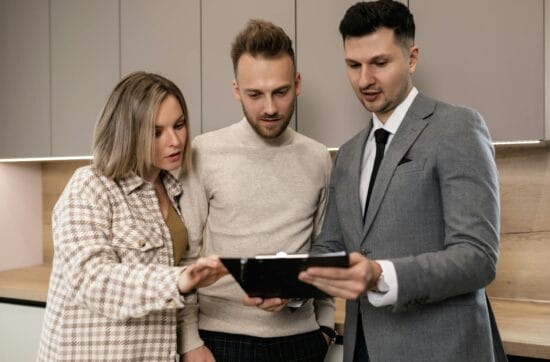 a couple looking at a clipped document